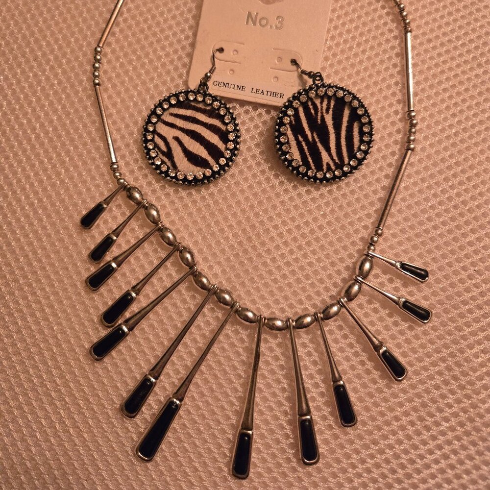 Fun silver & black dangle necklace with coordinating zebra dangle earrings